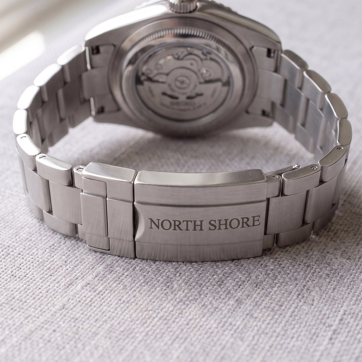 Clasp engraving on a steel bracelet clasp