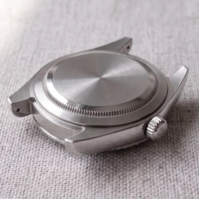 Closed steel caseback